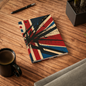 Grunge Union Jack A5 lined journal with distressed red, navy, and cream geometric burst design and black paint splatter – 128 pages, 90gsm paper, vinyl-laminated cover notebook for writing and journaling.