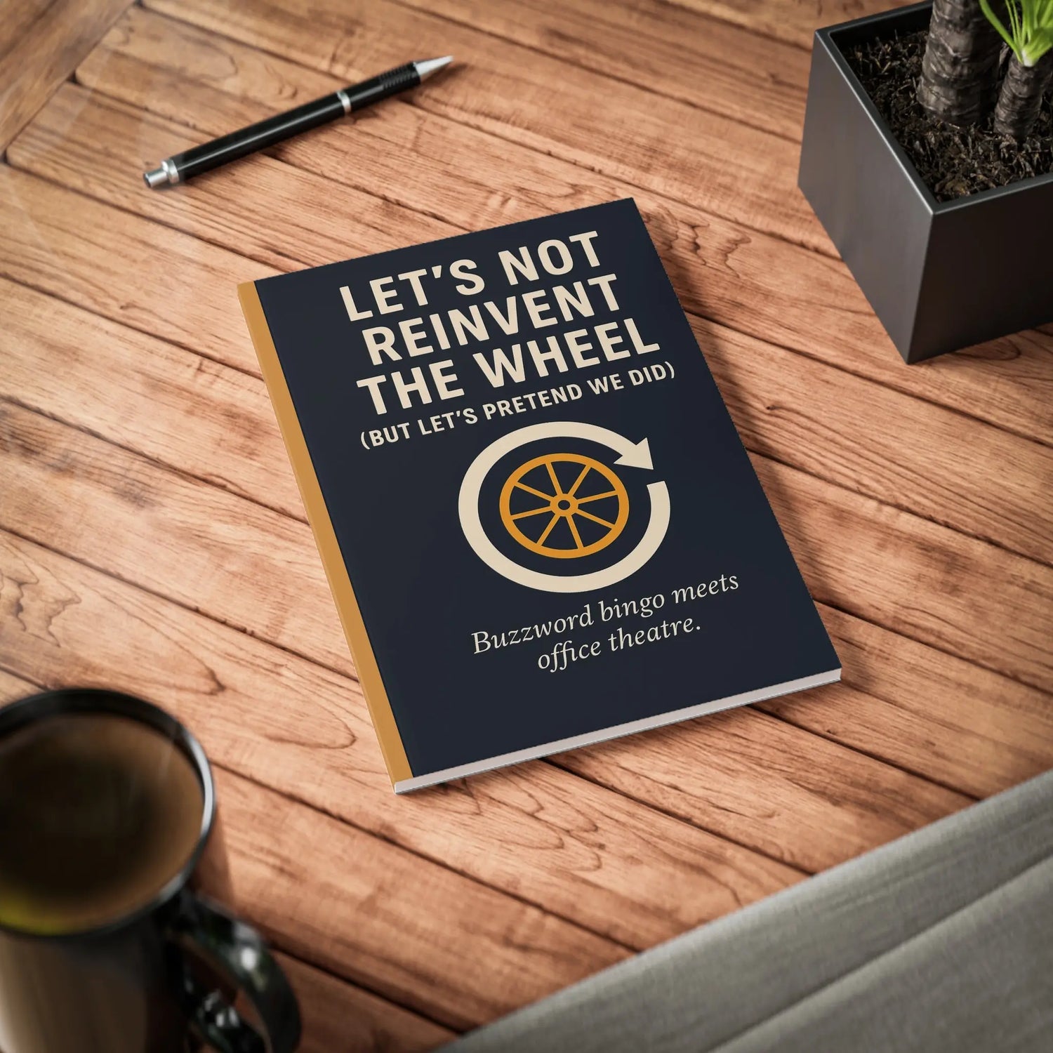A5 notebook with the text “Let’s Not Reinvent the Wheel (But Let’s Pretend We Did)” above a wheel icon in a circular arrow, with the tagline “Buzzword bingo meets office theatre” — perfect for corporate humor and workplace stationery.