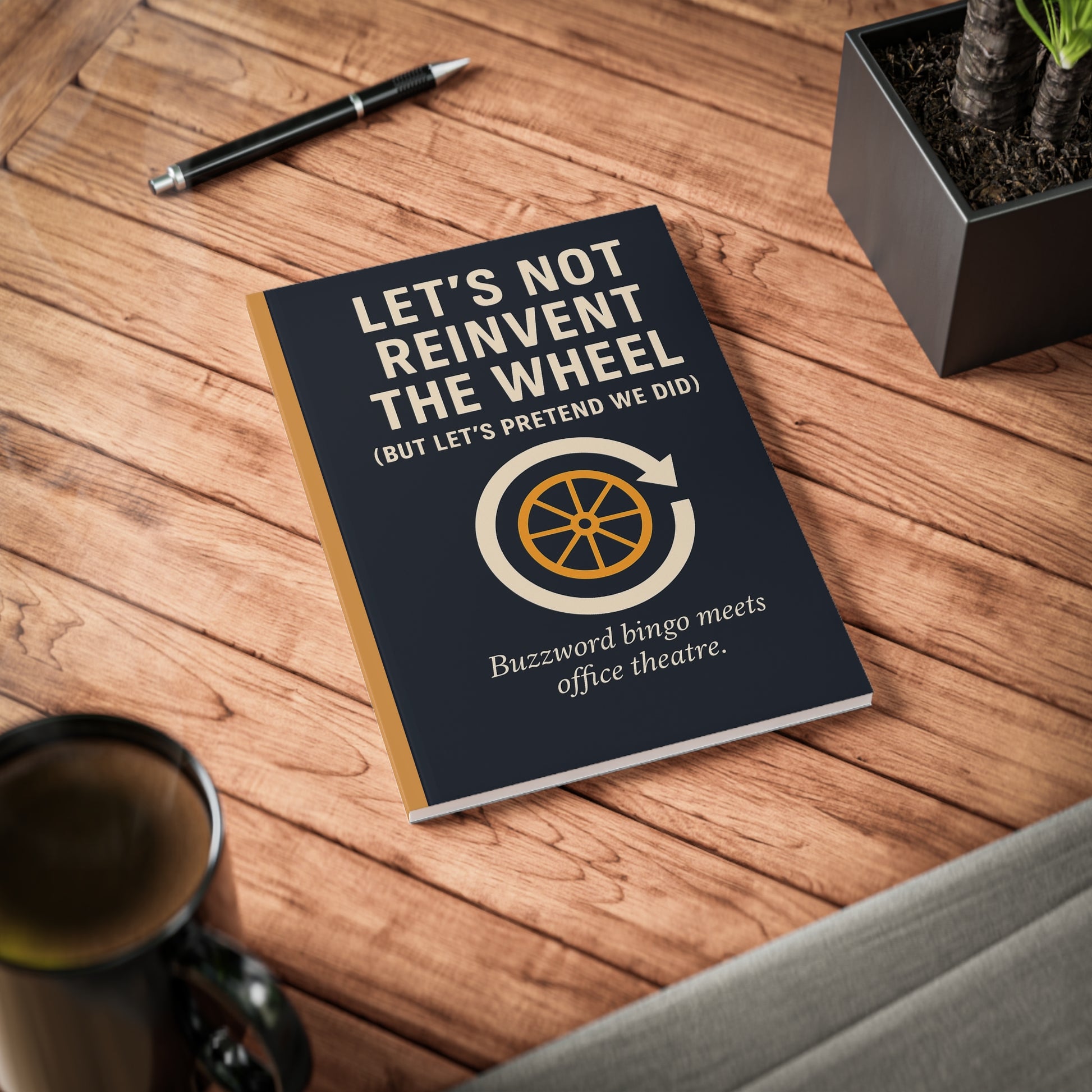 A5 notebook with the text “Let’s Not Reinvent the Wheel (But Let’s Pretend We Did)” above a wheel icon in a circular arrow, with the tagline “Buzzword bingo meets office theatre” — perfect for corporate humor and workplace stationery.