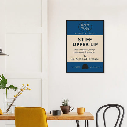 Vintage British parody framed print reading “Stiff Upper Lip – How to Suppress Feelings and Carry on Drinking Tea” in a retro book-cover design by Randello.