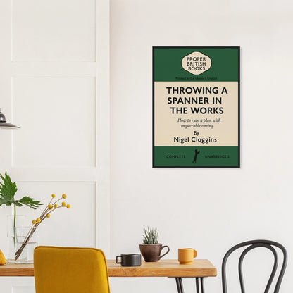 Vintage British parody framed print reading “Throwing a Spanner in the Works – How to Ruin a Plan with Impeccable Timing” in retro book-cover style by Randello.